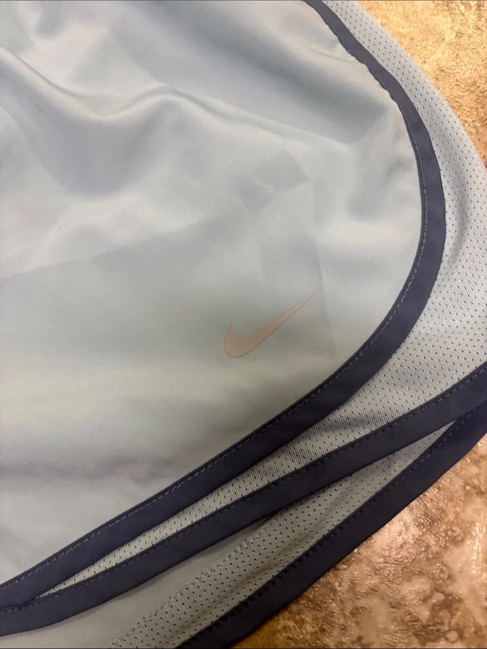Nike - Women’s Sky Blue Athletic Shorts with Navy Trim (size X-Large)